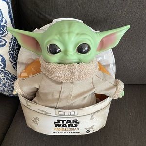 Baby Yoda doll, still in packaging